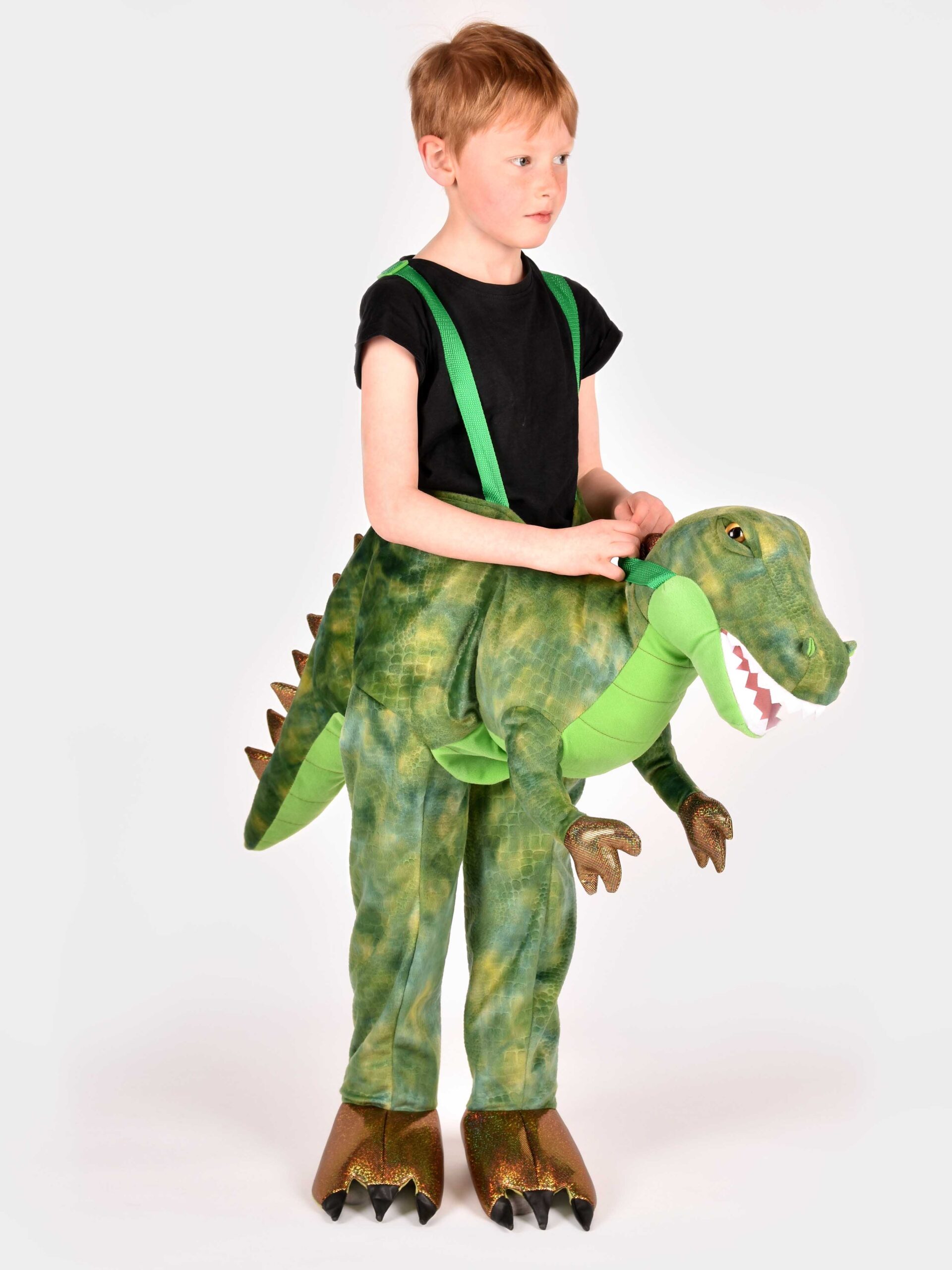 pojke iklädd grönmelerad vadderad dinosauriedräkt